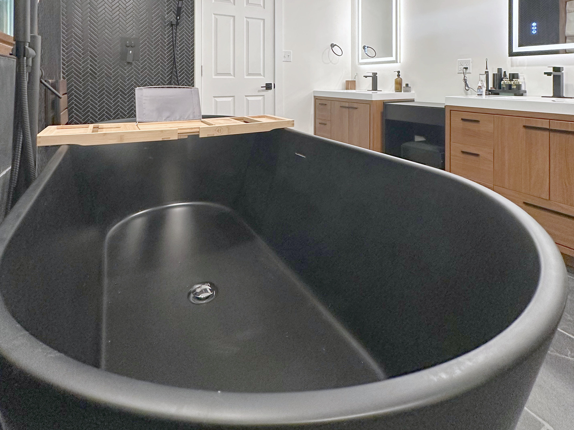 Bath with a black freestanding soaking tub
