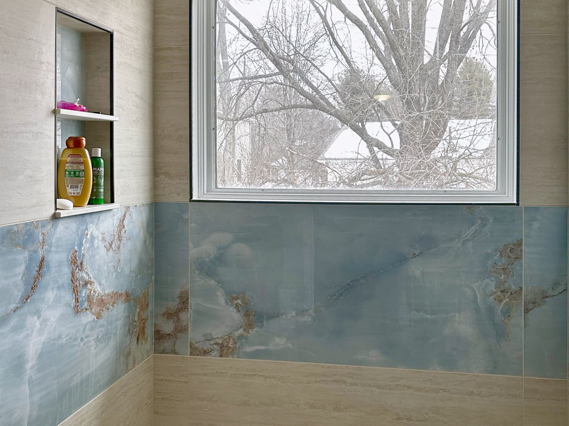 Shower with a band of blue tile