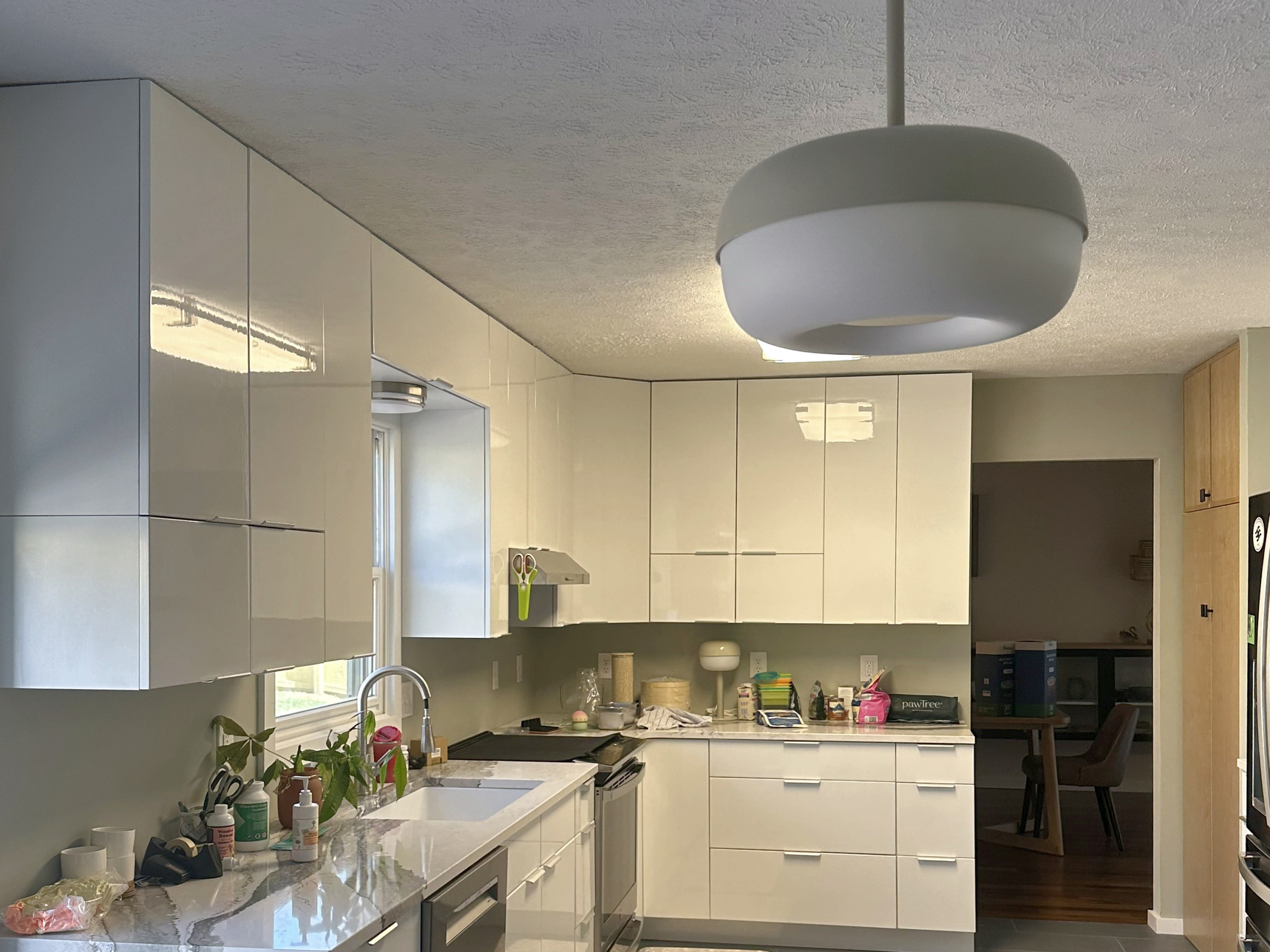Modern white kitchen with flat-panel cabinets